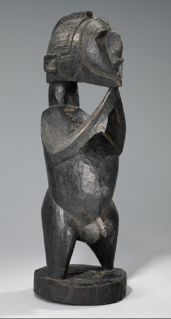 wooden carved male figure statue with detailed headgear and dark brown finish